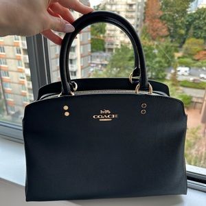 Black Coach bag, midsize.